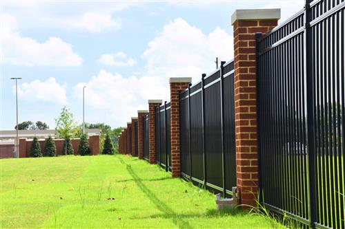 Iron fence surrounding school